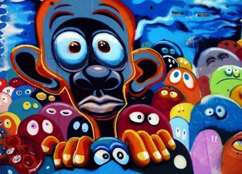 Qu'est-ce que le stress? Image d'un mur peint avec des personnages très colorés visiblement en état de stress.